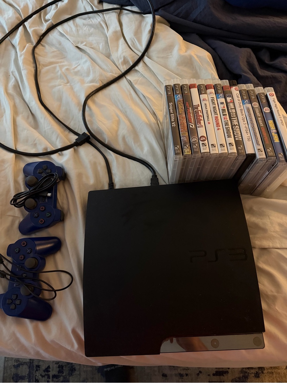 Sony PS3 Slim Black Console with Blue Wired Controllers and Game Bundle